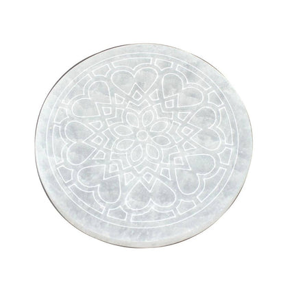 round selenite with rose flower design on white background
