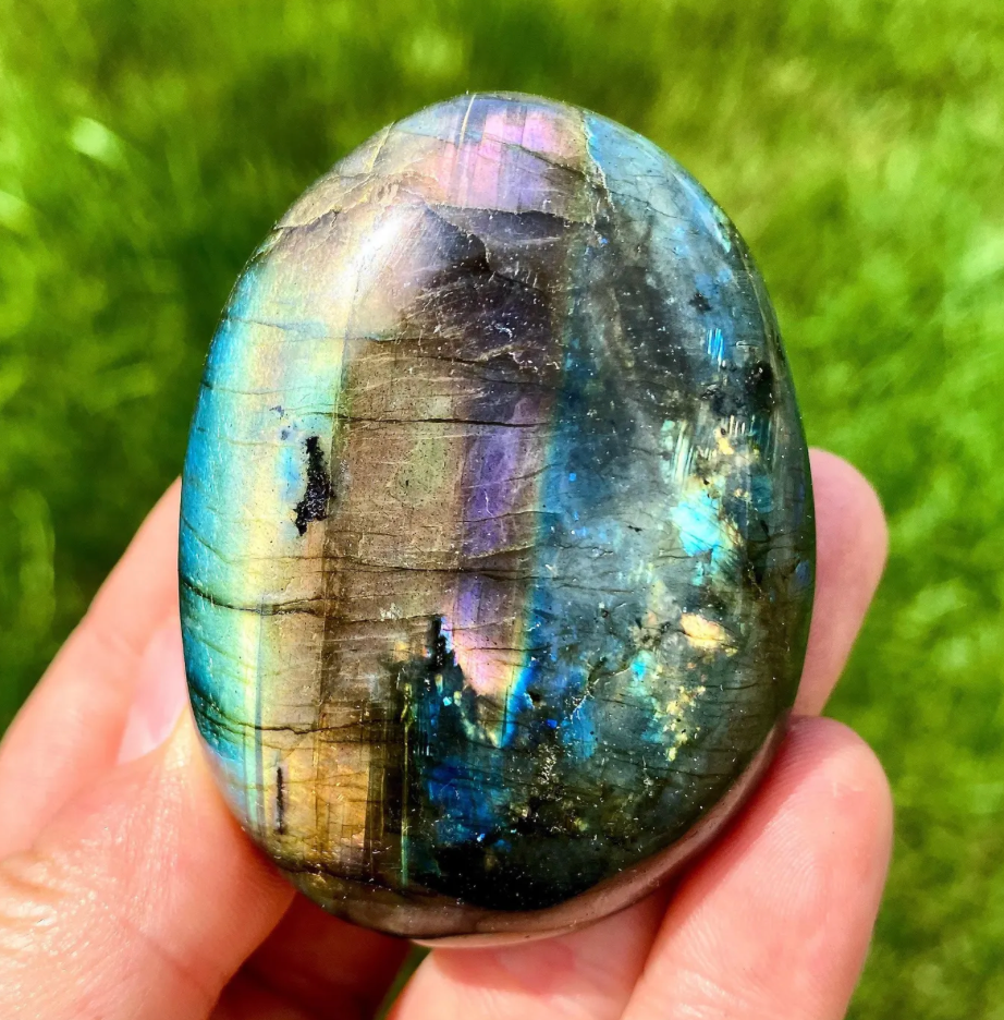 labradorite palm stone held
