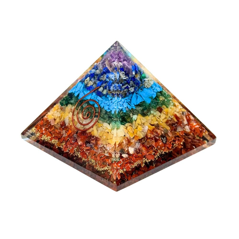 Organite Chakra stone pyramid with copper spiral on a white background