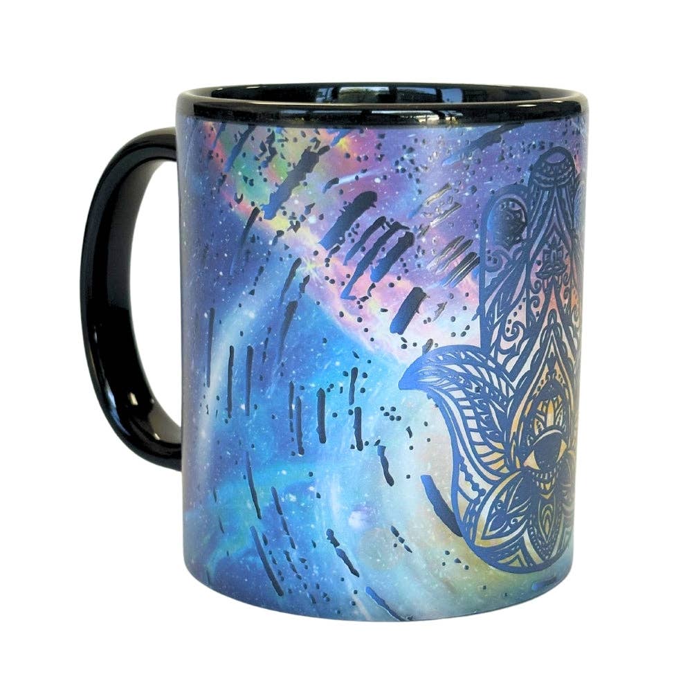 Side view of Hamsa hand design art 12-oz mug that changes color with hot beverage inside