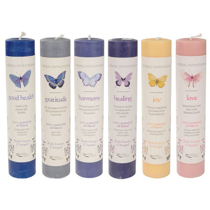 Set of six candles with butterfly illustrations and corresponding words on a white background