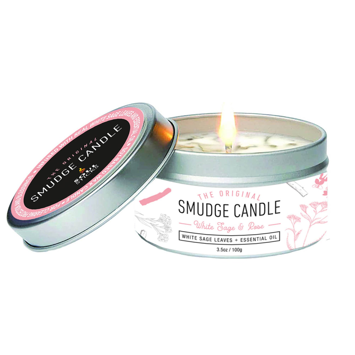 White Sage and Rose Smudge candle in a tin with a lit candle inside, on a white background