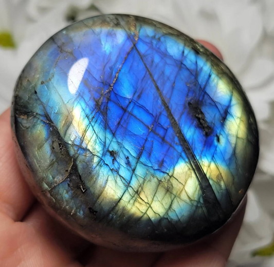 beautiful labradorite palm stone in hand