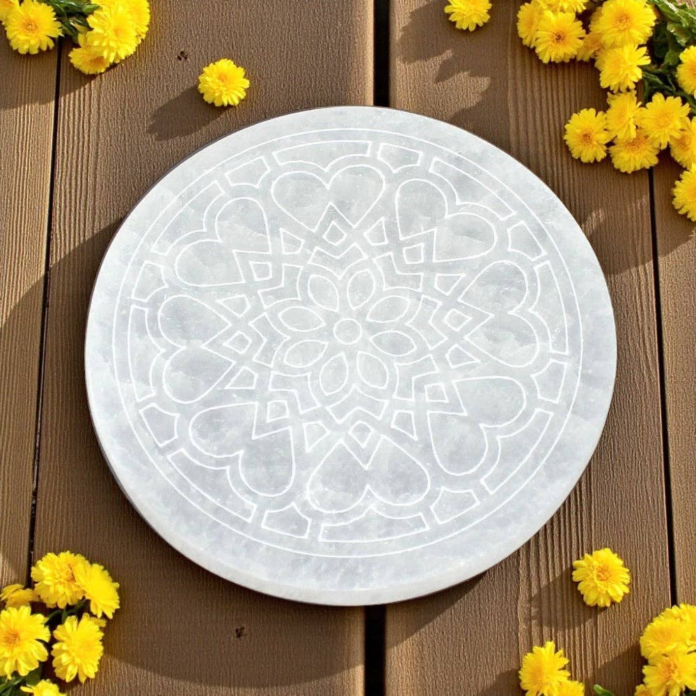 4 inch diameter round selenite charging plate with radiant heart flower design