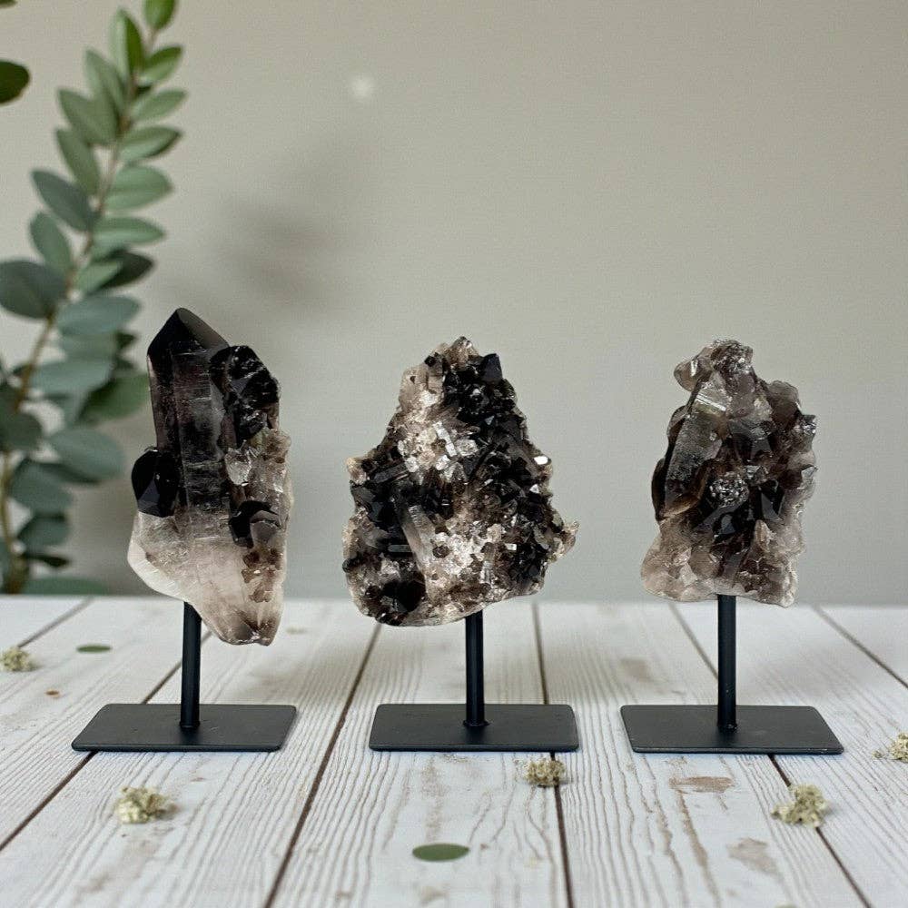 smoky quartz cluster on stand clears negative energy