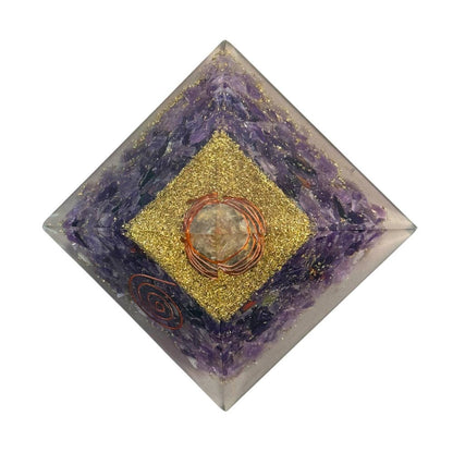 top view Decorative pyramid with purple amethyst crystal, copper spiral, copper wrap quartz, and gold and copper shavings
